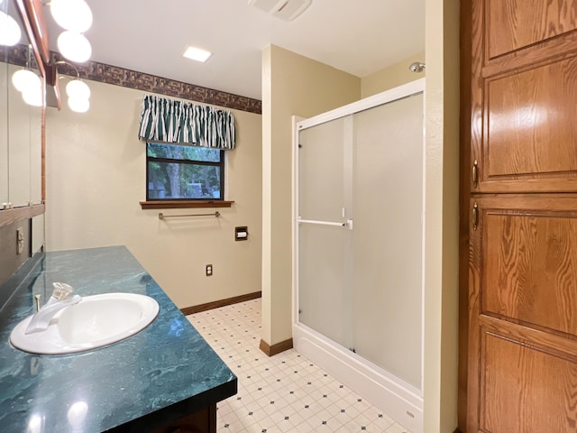 26225 Farm Rd Unit 1209, Eagle Rock, MO 65641 - bathroom featuring tile patterned floors, a stall shower, vanity, and baseboards