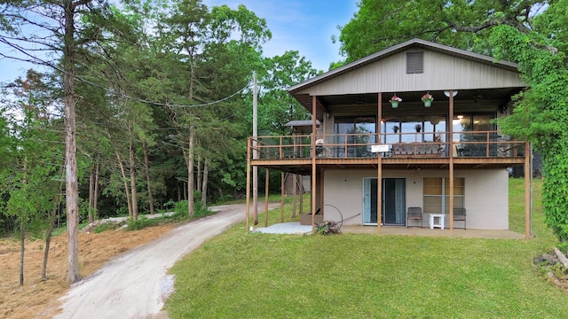 26225 Farm Rd Unit 1209, Eagle Rock, MO 65641 - rear view of house featuring a yard, a patio area, driveway, and a wooden deck