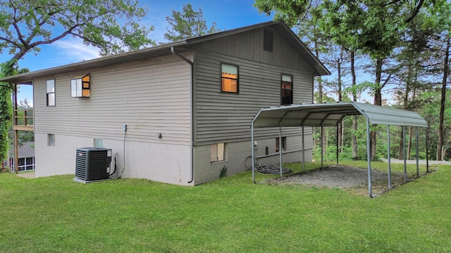 26225 Farm Rd Unit 1209, Eagle Rock, MO 65641 - back of property featuring a detached carport, a lawn, and central AC unit
