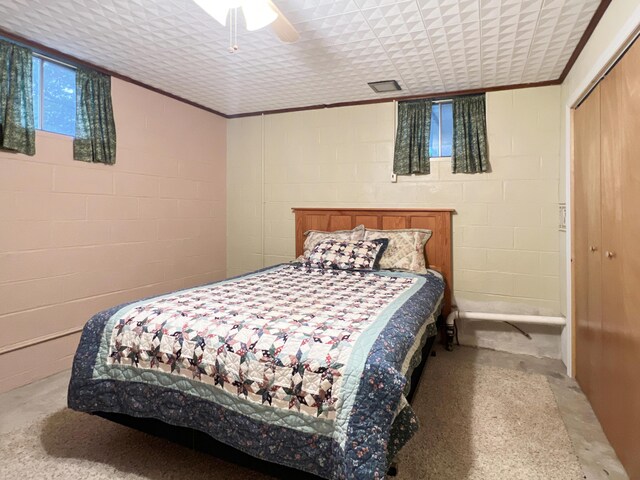 26225 Farm Rd Unit 1209, Eagle Rock, MO 65641 - bedroom featuring concrete block wall, a closet, and ceiling fan