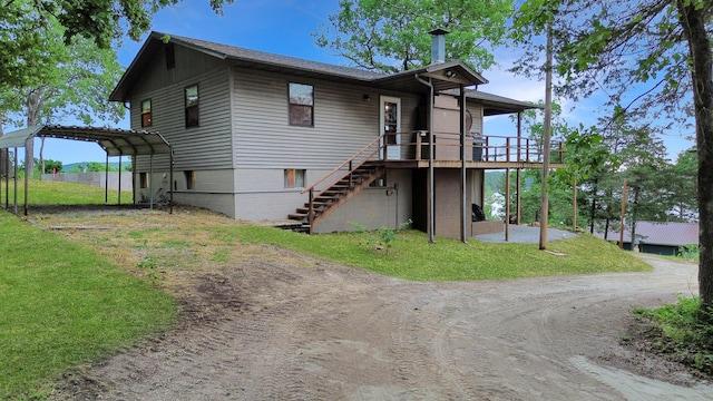 26225 Farm Rd Unit 1209, Eagle Rock, MO 65641 - view of front of home featuring dirt driveway, stairs, a deck, a detached carport, and a front yard