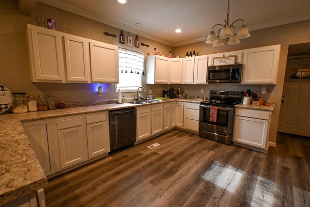 511 C St, Deepwater, MO 64740 - kitchen featuring appliances with stainless steel finishes, a sink, ornamental molding, a chandelier, and recessed lighting