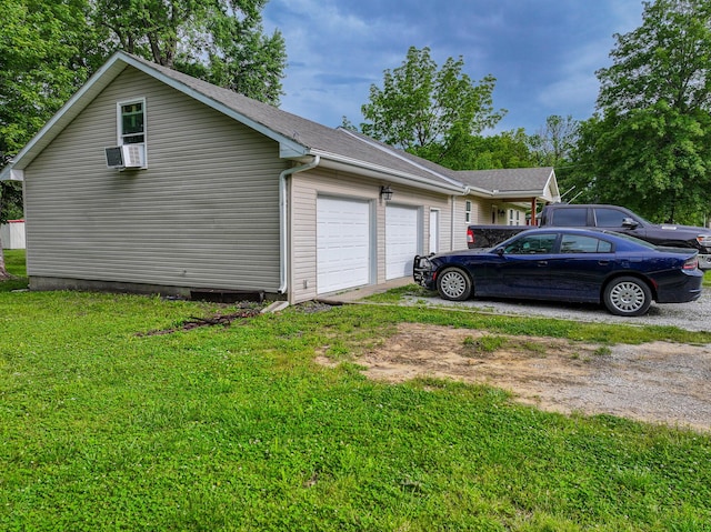 511 C St, Deepwater, MO 64740 - view of property exterior featuring driveway, a garage, and a yard