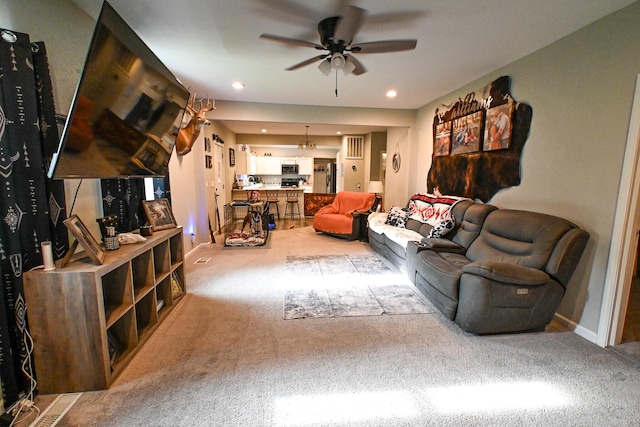 511 C St, Deepwater, MO 64740 - living room with a ceiling fan, carpet flooring, and baseboards