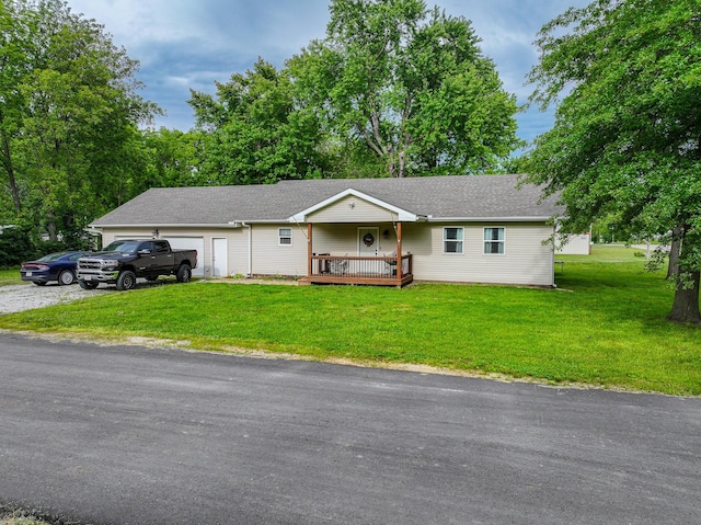 511 C St, Deepwater, MO 64740 - ranch-style house with a front yard, an attached garage, a deck, and a shingled roof