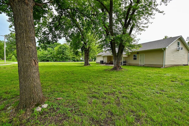 511 C St, Deepwater, MO 64740 - view of grassy yard with a wall unit AC