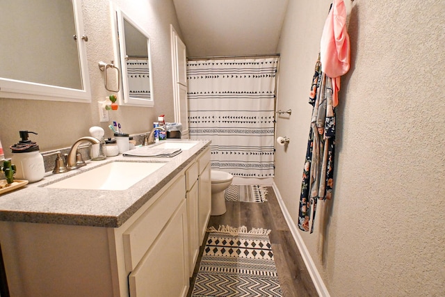 511 C St, Deepwater, MO 64740 - full bath featuring toilet, vanity, wood finished floors, baseboards, and curtained shower