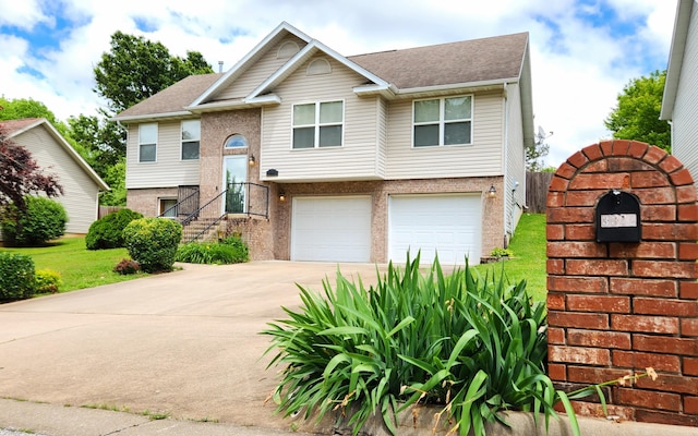 3342 S Valley View Dr, Springfield, MO 65807 - bi-level home with an attached garage, driveway, and roof with shingles