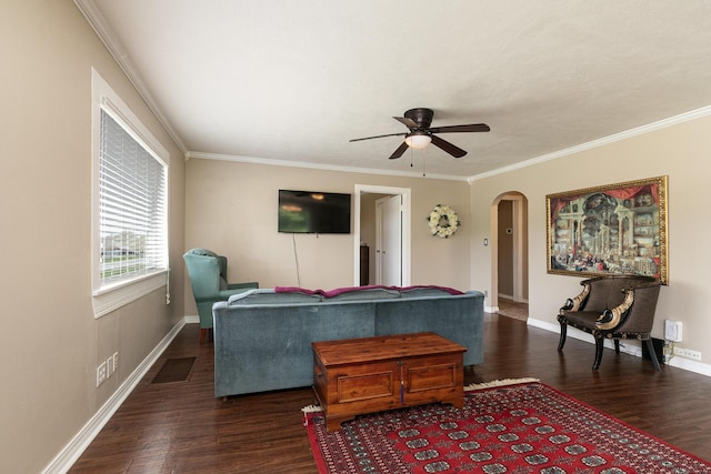 1104 E Buffalo St, Bolivar, MO 65613 - living room featuring arched walkways, wood finished floors, a ceiling fan, crown molding, and baseboards