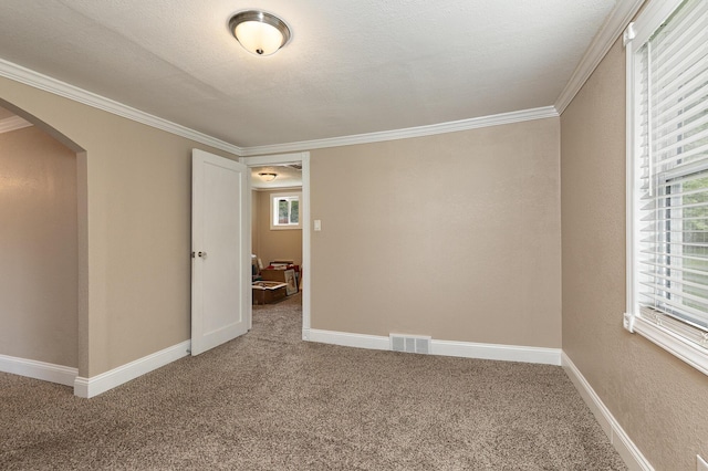 1104 E Buffalo St, Bolivar, MO 65613 - carpeted spare room featuring arched walkways, ornamental molding, and baseboards