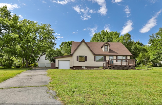 1104 E Buffalo St, Bolivar, MO 65613 - view of front of property with a garage, a wooden deck, and a front lawn