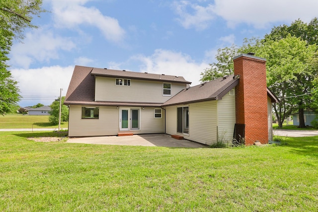 1104 E Buffalo St, Bolivar, MO 65613 - rear view of house featuring a patio, a yard, french doors, and a chimney
