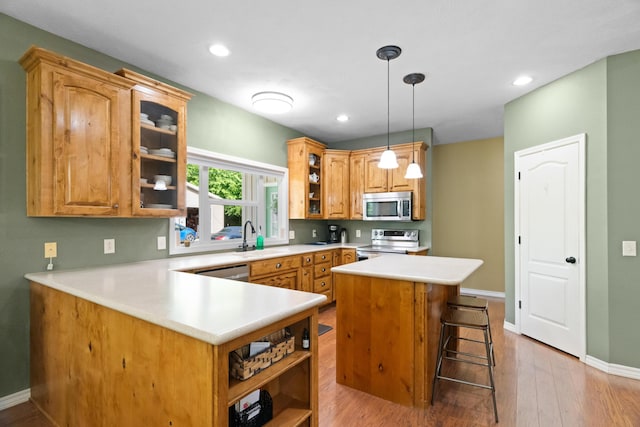 36205 State Highway 413, Crane, MO 65633 - kitchen with stainless steel appliances, open shelves, a sink, light wood-type flooring, and recessed lighting