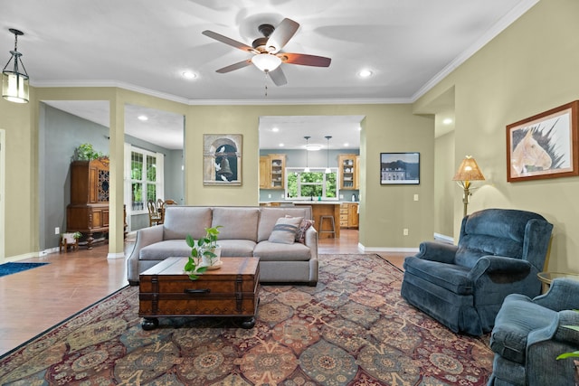 36205 State Highway 413, Crane, MO 65633 - living area with plenty of natural light, baseboards, light wood-style flooring, ceiling fan, and ornamental molding