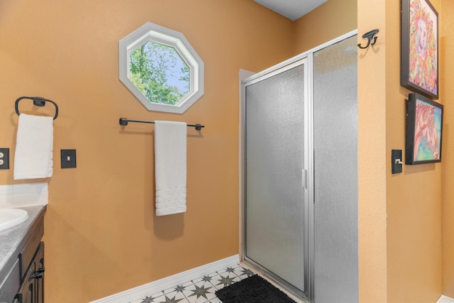 36205 State Highway 413, Crane, MO 65633 - full bath featuring a stall shower, vanity, and baseboards