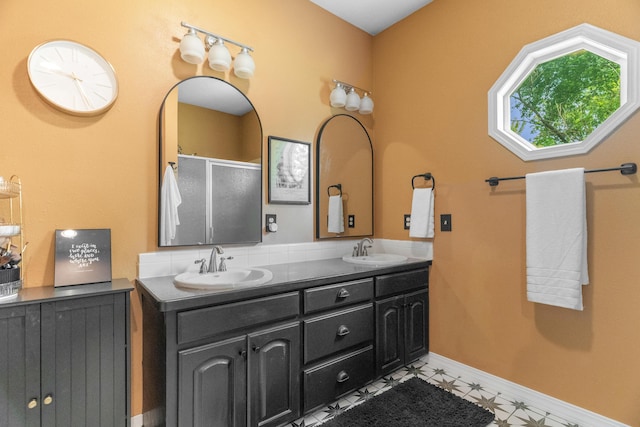 36205 State Highway 413, Crane, MO 65633 - bathroom featuring double vanity, baseboards, and a shower with door