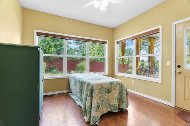36205 State Highway 413, Crane, MO 65633 - bedroom featuring baseboards, hardwood / wood-style floors, and ceiling fan
