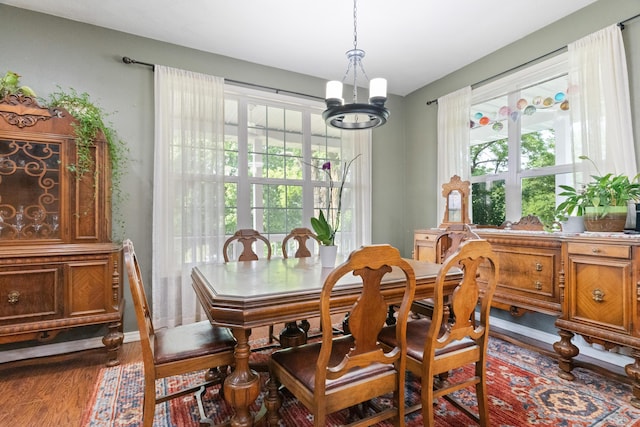 36205 State Highway 413, Crane, MO 65633 - dining space featuring a chandelier, dark wood-type flooring, and plenty of natural light