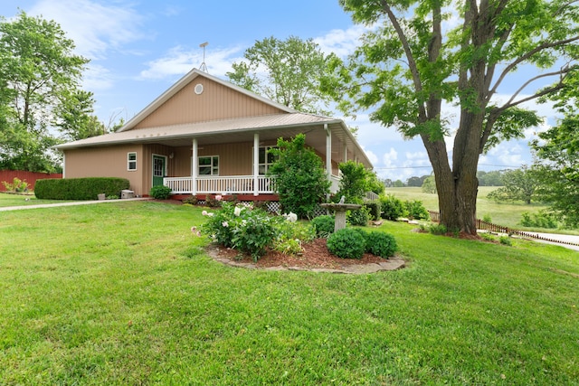 36205 State Highway 413, Crane, MO 65633 - farmhouse-style home featuring a porch