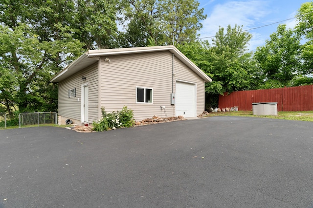 36205 State Highway 413, Crane, MO 65633 - garage featuring asphalt driveway
