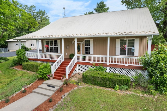 36205 State Highway 413, Crane, MO 65633 - bungalow with a porch, metal roof, and a front lawn