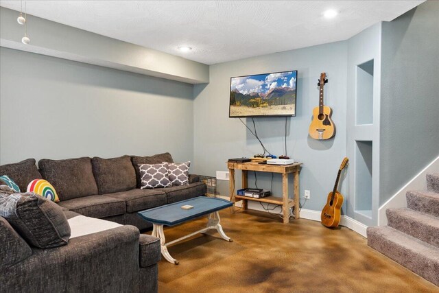 1270 E Ogorman Ct, Springfield, MO 65803 - living room featuring baseboards, recessed lighting, concrete flooring, and stairs