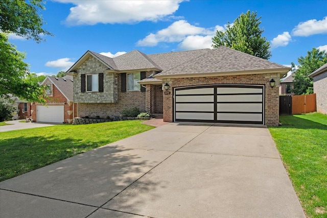 1270 E Ogorman Ct, Springfield, MO 65803 - view of front of house with brick siding, an attached garage, driveway, and a shingled roof