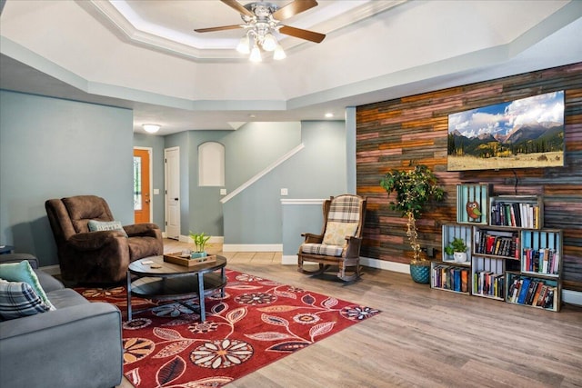 1270 E Ogorman Ct, Springfield, MO 65803 - living area with ceiling fan, wood finished floors, baseboards, stairs, and a raised ceiling