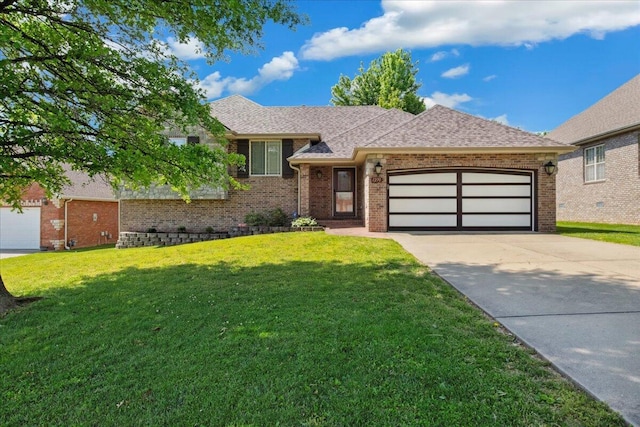 1270 E Ogorman Ct, Springfield, MO 65803 - view of front of property featuring a garage, brick siding, a front lawn, and driveway