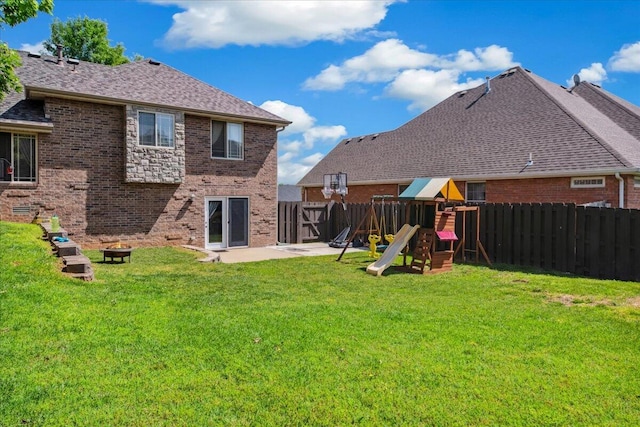 1270 E Ogorman Ct, Springfield, MO 65803 - rear view of property featuring brick siding, a playground, a patio area, and a shingled roof
