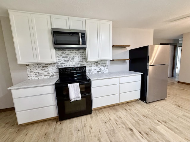 8030 Indiana Dr, Houston, MO 65483 - kitchen featuring stainless steel appliances, open shelves, white cabinets, light wood-style flooring, and backsplash