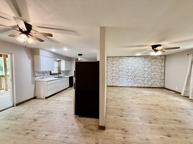 8030 Indiana Dr, Houston, MO 65483 - kitchen featuring a sink, a ceiling fan, light countertops, baseboards, and a textured ceiling
