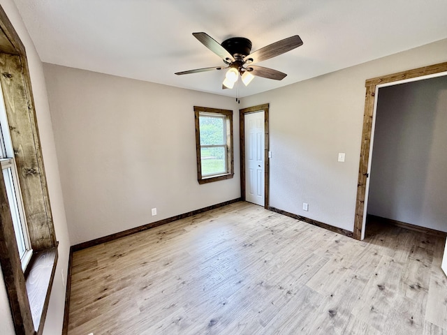 8030 Indiana Dr, Houston, MO 65483 - unfurnished bedroom featuring baseboards, light wood-type flooring, a ceiling fan, and a closet