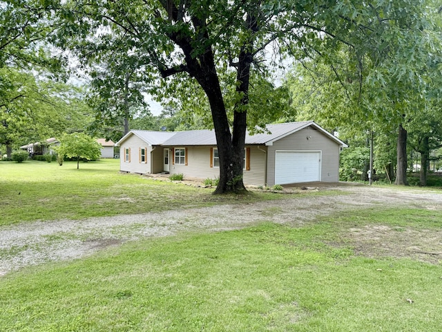 8030 Indiana Dr, Houston, MO 65483 - ranch-style home featuring dirt driveway, a front lawn, metal roof, and an attached garage