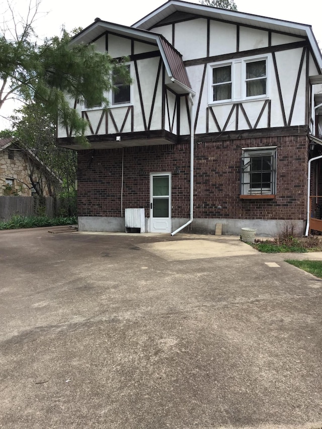 310 S 6th St, Thayer, MO 65791 - back of property with brick siding and stucco siding