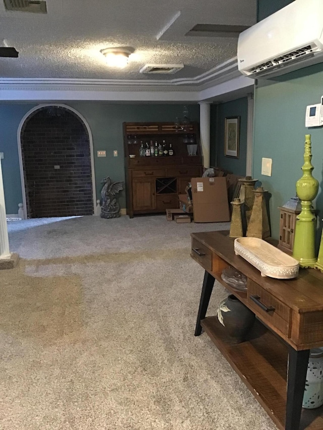 310 S 6th St, Thayer, MO 65791 - living room with a wall unit AC, carpet, and a textured ceiling