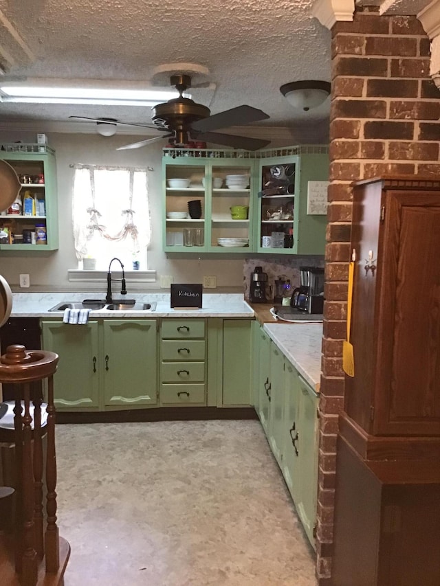 310 S 6th St, Thayer, MO 65791 - kitchen with green cabinetry, open shelves, a sink, a textured ceiling, and light countertops