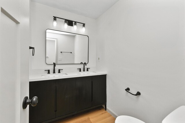 2658 S Hillsboro, Springfield, MO 65802 - bathroom featuring toilet, wood finished floors, double vanity, and baseboards