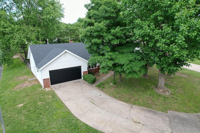 2658 S Hillsboro, Springfield, MO 65802 - view of front of home with brick siding, an attached garage, driveway, a front lawn, and roof with shingles