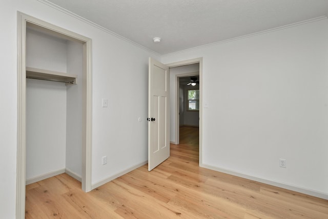 2658 S Hillsboro, Springfield, MO 65802 - unfurnished bedroom with light wood finished floors, ornamental molding, baseboards, and a closet