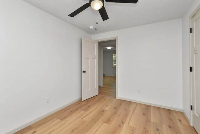 2658 S Hillsboro, Springfield, MO 65802 - unfurnished bedroom featuring light wood-style floors, baseboards, and a ceiling fan