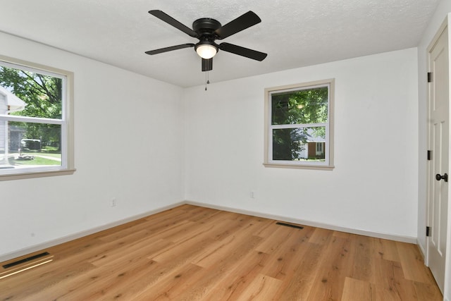 2658 S Hillsboro, Springfield, MO 65802 - unfurnished room featuring light wood-style flooring, baseboards, and a ceiling fan