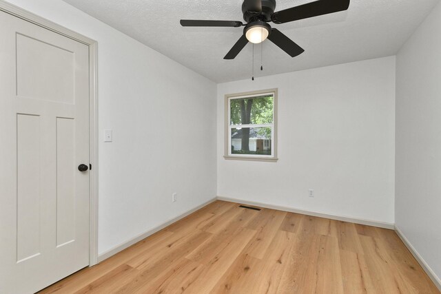2658 S Hillsboro, Springfield, MO 65802 - empty room with light wood finished floors, baseboards, and a ceiling fan