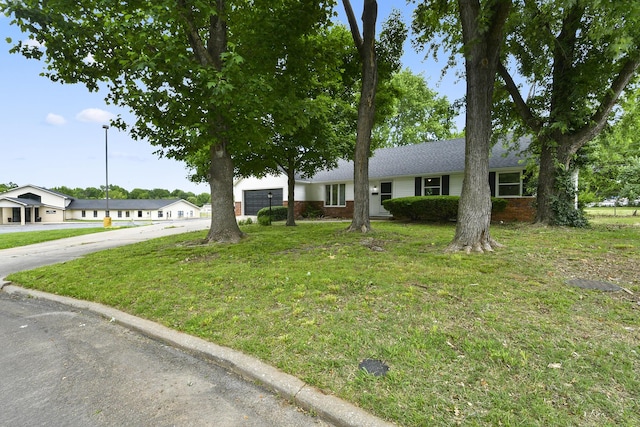 2658 S Hillsboro, Springfield, MO 65802 - ranch-style home with concrete driveway, brick siding, a front yard, and a garage
