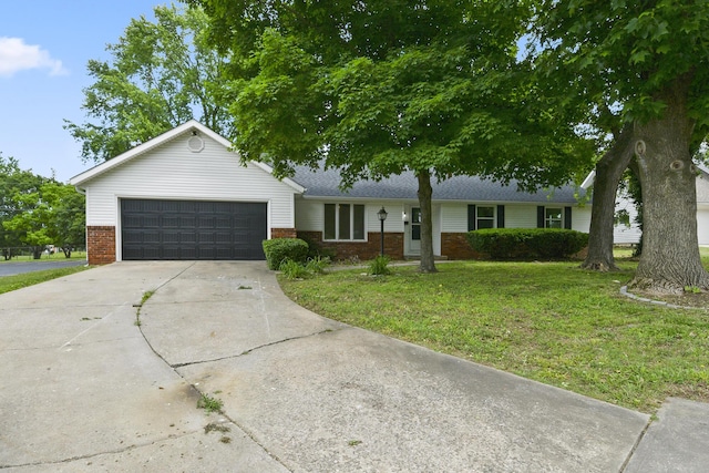 2658 S Hillsboro, Springfield, MO 65802 - ranch-style house featuring brick siding, an attached garage, concrete driveway, and a front lawn