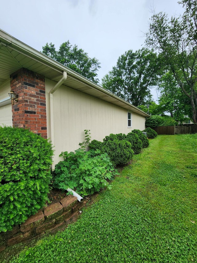 3451 S Geri Ct, Springfield, MO 65807 - view of property exterior featuring a garage and brick siding
