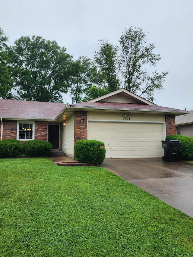 3451 S Geri Ct, Springfield, MO 65807 - single story home with concrete driveway, brick siding, a garage, and a front lawn