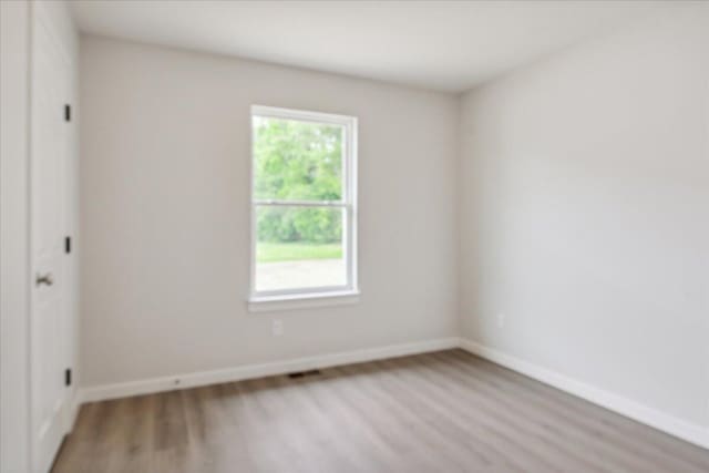 1052 S Overhill Ave, Springfield, MO 65802 - empty room with light wood finished floors and baseboards