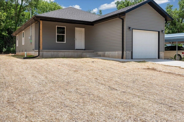 1052 S Overhill Ave, Springfield, MO 65802 - view of front of property with an attached garage and roof with shingles