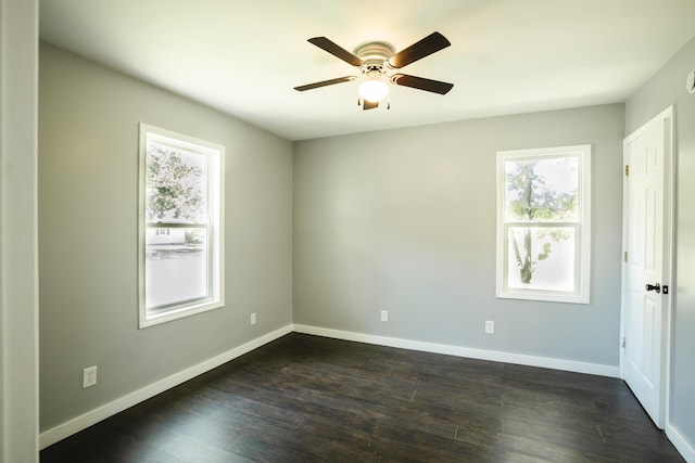1443 6th St, West Plains, MO 65775 - empty room with plenty of natural light, a ceiling fan, dark wood-type flooring, and baseboards